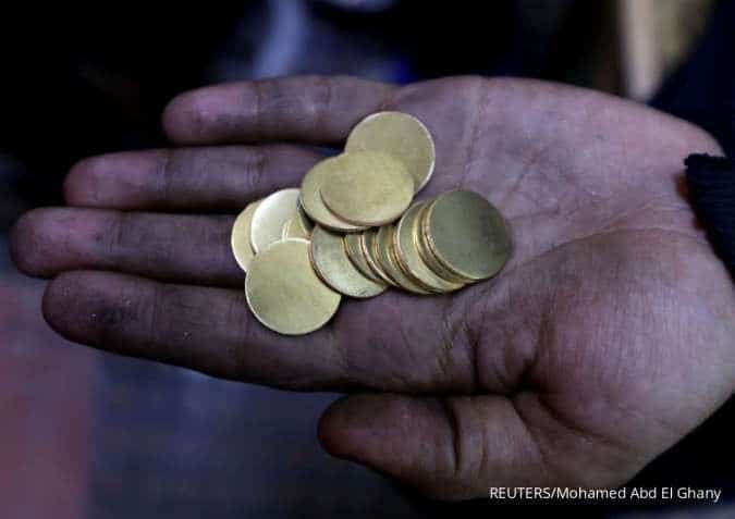 Emas Dunia Bersiap Catat Penurunan Mingguan Jumat (24/4) di Tengah Reli Harga Minyak